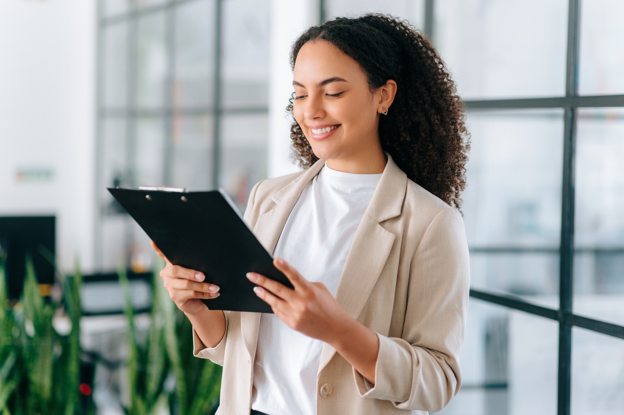 Successful elegant hispanic or brazilian woman, successful employee of a company, female teacher