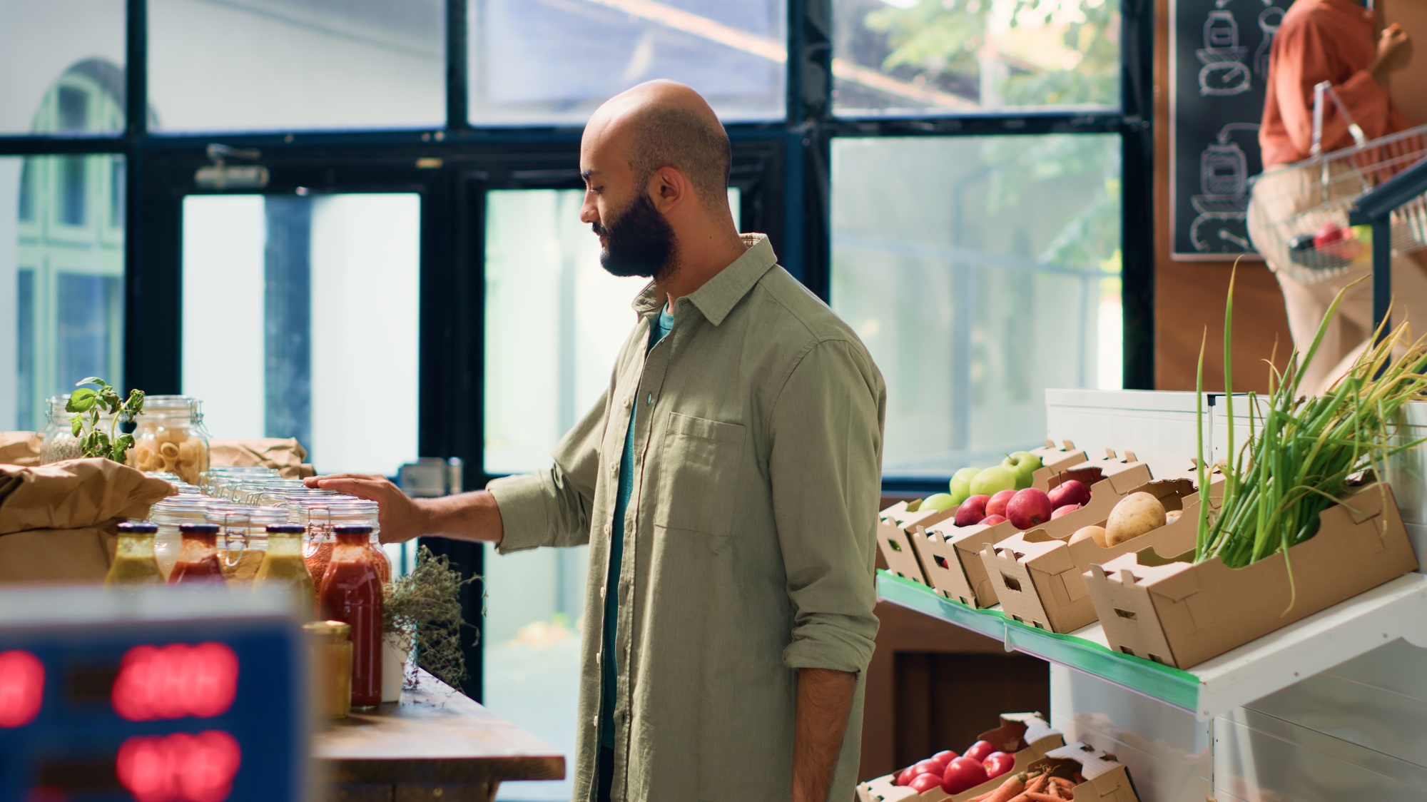 Young man shops at local supermarket